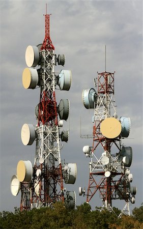 dish satellite tower - telecommunication two towers, with a lot of different antennas Stock Photo - Budget Royalty-Free & Subscription, Code: 400-05681107