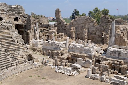 The ruins of the ancient amphitheater. Turkey, Side. Amid the ruins - ancient columns. Stock Photo - Budget Royalty-Free & Subscription, Code: 400-05682560