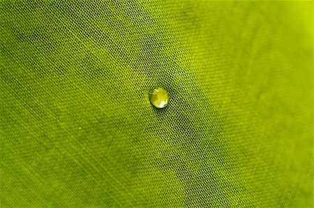 satin cloth decoration - close up of a green cotton scarf with clear crystal stone Stock Photo - Budget Royalty-Free & Subscription, Code: 400-05683606