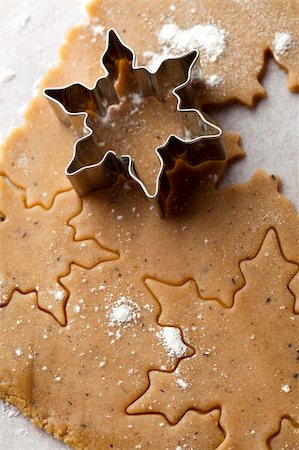 simsearch:400-05721521,k - Making gingerbread cookies for Christmas. Gingerbread dough with star shapes and a cutter. Stock Photo - Budget Royalty-Free & Subscription, Code: 400-05696398
