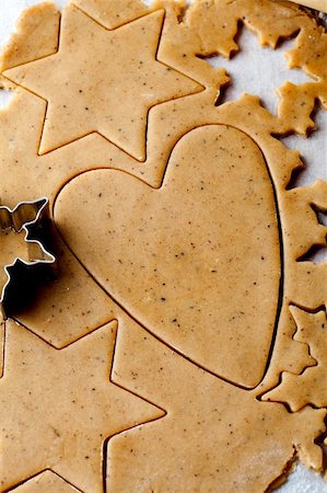 simsearch:400-05721521,k - Making gingerbread cookies for Christmas. Gingerbread dough with star shapes and a heart. Stock Photo - Budget Royalty-Free & Subscription, Code: 400-05696402