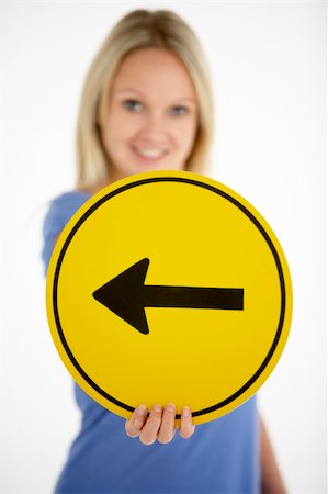 simsearch:400-05696622,k - Woman Holding Road Traffic Sign Stock Photo - Budget Royalty-Free & Subscription, Code: 400-05696558