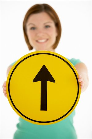 simsearch:400-05696622,k - Woman Holding Road Traffic Sign Stock Photo - Budget Royalty-Free & Subscription, Code: 400-05696582