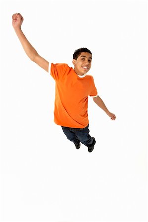 simsearch:400-05697219,k - Young Boy Leaping In Studio Stock Photo - Budget Royalty-Free & Subscription, Code: 400-05697133