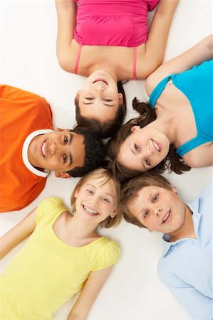 simsearch:400-05697219,k - Overhead View Of Five Young Children In Studio Stock Photo - Budget Royalty-Free & Subscription, Code: 400-05697142