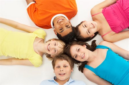 simsearch:400-05697219,k - Overhead View Of Five Young Children In Studio Stock Photo - Budget Royalty-Free & Subscription, Code: 400-05697143