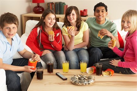 simsearch:400-04199223,k - Group Of Children Eating Burgers At Home Stock Photo - Budget Royalty-Free & Subscription, Code: 400-05697163