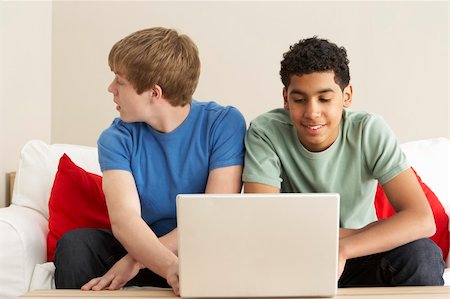 simsearch:400-05697169,k - Two Boys Using Laptop At Home Stock Photo - Budget Royalty-Free & Subscription, Code: 400-05697175