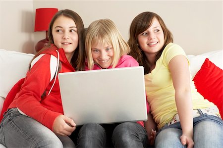 simsearch:400-05697169,k - Group Of Three Girls Using Laptop At Home Stock Photo - Budget Royalty-Free & Subscription, Code: 400-05697170