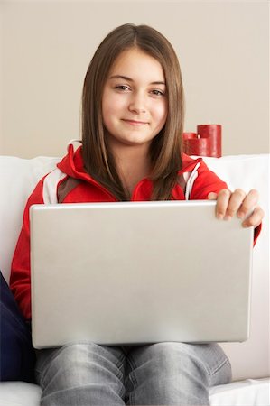 simsearch:400-05697169,k - Young Girl Using Laptop At Home Stock Photo - Budget Royalty-Free & Subscription, Code: 400-05697185
