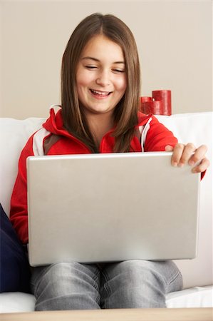 simsearch:400-05697169,k - Young Girl Using Laptop At Home Stock Photo - Budget Royalty-Free & Subscription, Code: 400-05697186