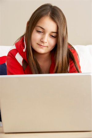 simsearch:400-05697169,k - Young Girl Using Laptop At Home Stock Photo - Budget Royalty-Free & Subscription, Code: 400-05697187