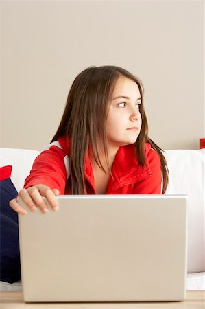 simsearch:400-05697169,k - Worried Looking Girl Using Laptop Stock Photo - Budget Royalty-Free & Subscription, Code: 400-05697189