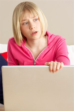 simsearch:400-05697169,k - Worried Looking Girl Using Laptop Stock Photo - Budget Royalty-Free & Subscription, Code: 400-05697193