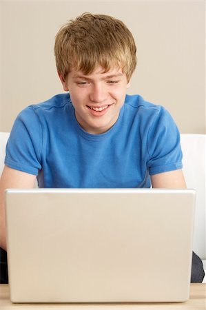 simsearch:400-05697169,k - Young Boy Using Laptop At Home Stock Photo - Budget Royalty-Free & Subscription, Code: 400-05697210