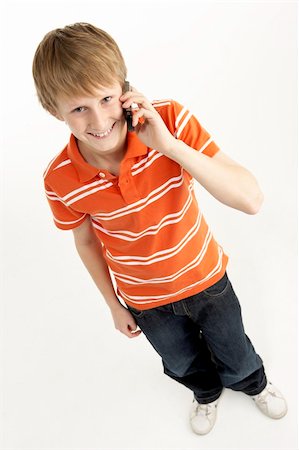 simsearch:400-05697219,k - Young Boy With Mobile Phone Stock Photo - Budget Royalty-Free & Subscription, Code: 400-05697334