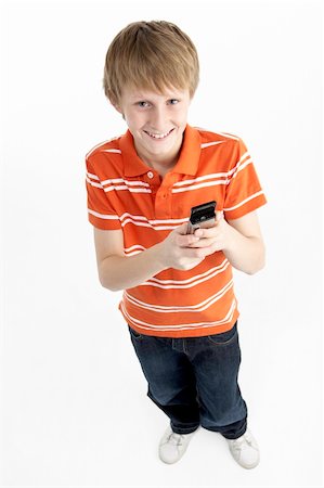 simsearch:400-05697219,k - Young Boy With Mobile Phone Stock Photo - Budget Royalty-Free & Subscription, Code: 400-05697335