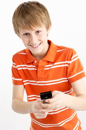 simsearch:400-05697219,k - Young Boy With Mobile Phone Stock Photo - Budget Royalty-Free & Subscription, Code: 400-05697332