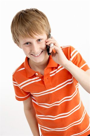 simsearch:400-05697219,k - Young Boy With Mobile Phone Stock Photo - Budget Royalty-Free & Subscription, Code: 400-05697333