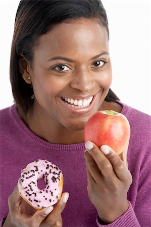 simsearch:400-05106591,k - Woman Choosing Between Apple And Doughnut Stock Photo - Budget Royalty-Free & Subscription, Code: 400-05697444