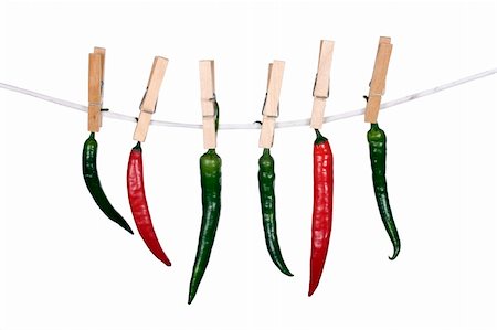 Peppers hanging on a rope on white Stock Photo - Budget Royalty-Free & Subscription, Code: 400-05699459
