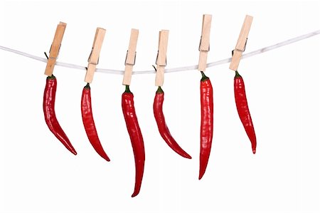 Peppers hanging on a rope on white Stock Photo - Budget Royalty-Free & Subscription, Code: 400-05699460