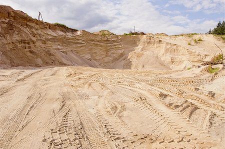 Sand pit. Sand special for construction. Pit full of fine sand and truck tracks. Foto de stock - Super Valor sin royalties y Suscripción, Código: 400-05690475