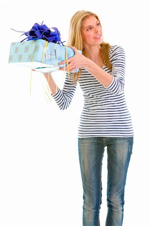 simsearch:400-05888428,k - Interested teengirl shaking present box trying to guess what's inside Stock Photo - Budget Royalty-Free & Subscription, Code: 400-05692914