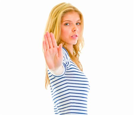 simsearch:400-05888428,k - Serious teen girl showing stop gesture isolated on white Stock Photo - Budget Royalty-Free & Subscription, Code: 400-05692911