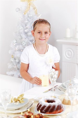 simsearch:400-05693119,k - Cute girl setting table for Christmas Stock Photo - Budget Royalty-Free & Subscription, Code: 400-05693122