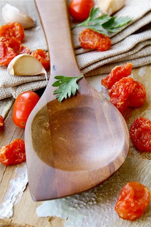 Old wooden spoon  on kitchen table Stock Photo - Budget Royalty-Free & Subscription, Code: 400-05706397