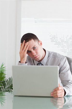 simsearch:400-05709564,k - Close up of young businessman having a problem with his laptop Stock Photo - Budget Royalty-Free & Subscription, Code: 400-05709630