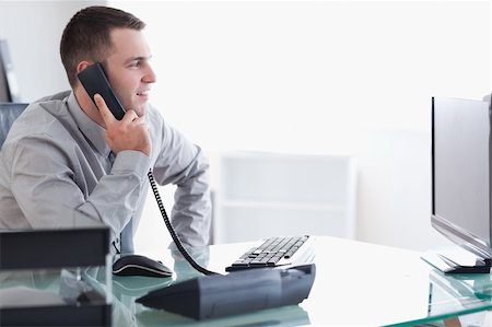 simsearch:400-05710264,k - Young businessman talking on the phone Stock Photo - Budget Royalty-Free & Subscription, Code: 400-05709689