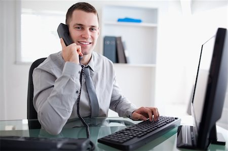 simsearch:400-05710264,k - Smiling businessman having a dialogue on the phone Stock Photo - Budget Royalty-Free & Subscription, Code: 400-05709705