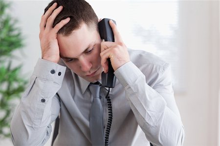 simsearch:400-05710264,k - Disappointed unhappy businessman on the phone Stock Photo - Budget Royalty-Free & Subscription, Code: 400-05709715