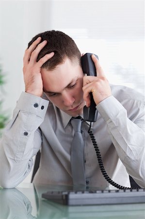 simsearch:400-05710264,k - Depressed businessman getting disappointed on the phone Stock Photo - Budget Royalty-Free & Subscription, Code: 400-05709716