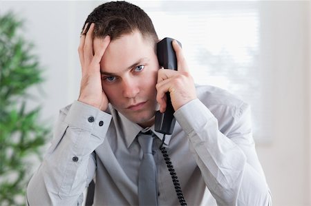 simsearch:400-05710264,k - Disappointed businessman getting bad news on the phone Stock Photo - Budget Royalty-Free & Subscription, Code: 400-05709718