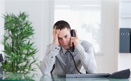simsearch:400-05710264,k - Depressed businessman getting disappointing news on the phone Stock Photo - Budget Royalty-Free & Subscription, Code: 400-05709719