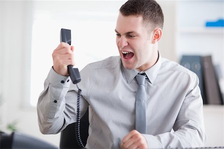simsearch:400-05710264,k - Angry businessman yelling at the phone Stock Photo - Budget Royalty-Free & Subscription, Code: 400-05709712