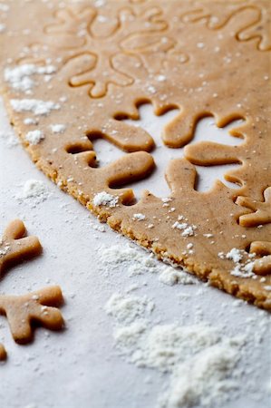 simsearch:400-05721521,k - Making gingerbread cookies for Christmas. Gingerbread dough with snowflake shapes. Stock Photo - Budget Royalty-Free & Subscription, Code: 400-05701345