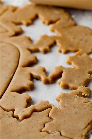 simsearch:400-05721521,k - Making gingerbread cookies for Christmas. Gingerbread dough with star shapes. Stock Photo - Budget Royalty-Free & Subscription, Code: 400-05701346