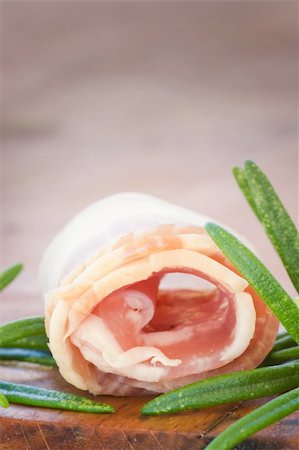 simsearch:400-06207145,k - Slices of rolled bacon with rosemary Stock Photo - Budget Royalty-Free & Subscription, Code: 400-05701407