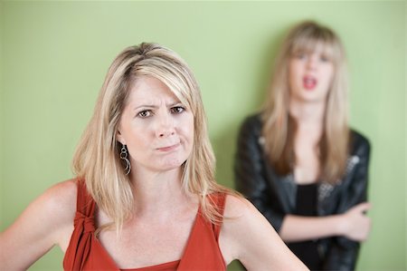 simsearch:400-05918419,k - Angry mom with daughter in the background Stock Photo - Budget Royalty-Free & Subscription, Code: 400-05702281