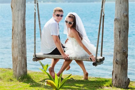 simsearch:400-05328142,k - Bride and groom on the tropical beach Stock Photo - Budget Royalty-Free & Subscription, Code: 400-05703161
