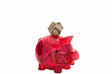 simsearch:400-07218287,k - Pink piggy bank with money inside,One dollar bill is folded and is being put in. This has a clipping path. Stock Photo - Budget Royalty-Free & Subscription, Code: 400-05714636