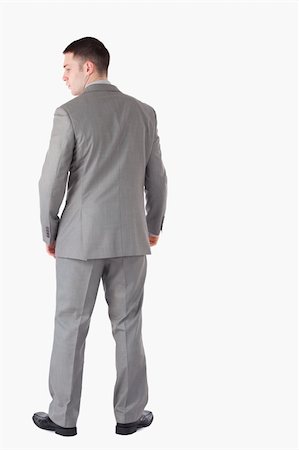 formal man model - Portrait of a businessman turning his back against a white background Stock Photo - Budget Royalty-Free & Subscription, Code: 400-05714866