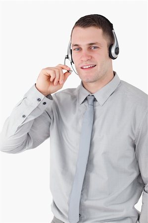 simsearch:400-03933798,k - Portrait of a smiling assistant using a headset against a white background Stock Photo - Budget Royalty-Free & Subscription, Code: 400-05715027