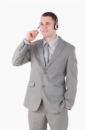 simsearch:400-03933798,k - Portrait of an operator using a headset against a white background Stock Photo - Budget Royalty-Free & Subscription, Code: 400-05715020