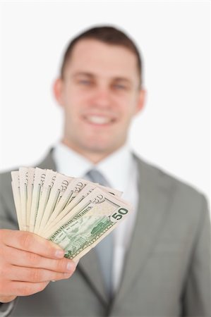 simsearch:400-05718324,k - Portrait of a smiling businessman showing notes against a white background Stock Photo - Budget Royalty-Free & Subscription, Code: 400-05715207