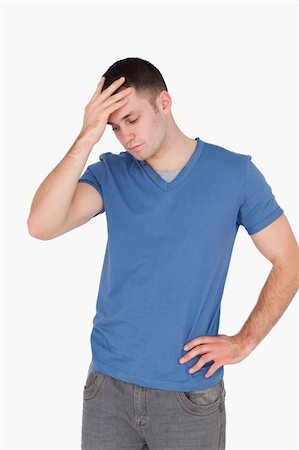 simsearch:400-04918265,k - Portrait of a depressed man against a white background Stock Photo - Budget Royalty-Free & Subscription, Code: 400-05715261